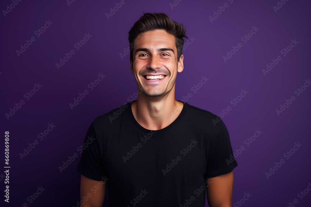 Handsome male model posing on a colored background in casual clothing. Generative AI.