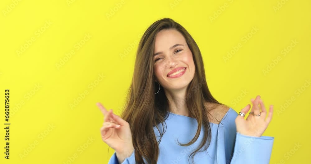 Brunette woman looking camera pointing fingers herself ask me no i do not need it. Girl waving her hands and say no isolated on yellow background. Woman wear blue sweater. Brunette woman looking camera pointing fingers herself ask me no i do not need it. Girl waving her hands and say no isolated on yellow background. Woman wear blue sweater.