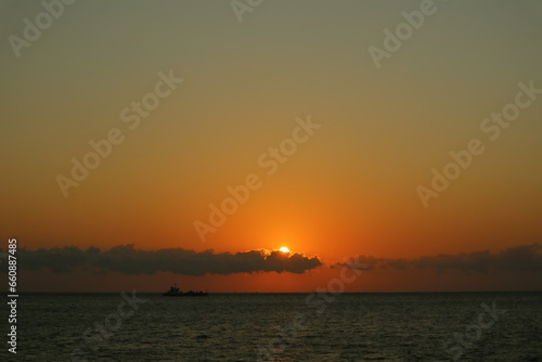 A very beautiful sunrise in the middle of the ocean © andik