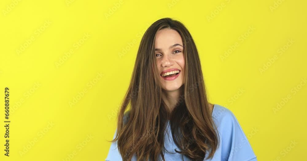 It will be our little secret. Charming caucasian girl smiling with interest while showing shh gesture, saying shush with index finger over smiling mouth. Excited, laughing girl on yellow background. It will be our little secret. Charming caucasian girl smiling with interest while showing shh gesture, saying shush with index finger over smiling mouth. Excited, laughing girl on yellow background.