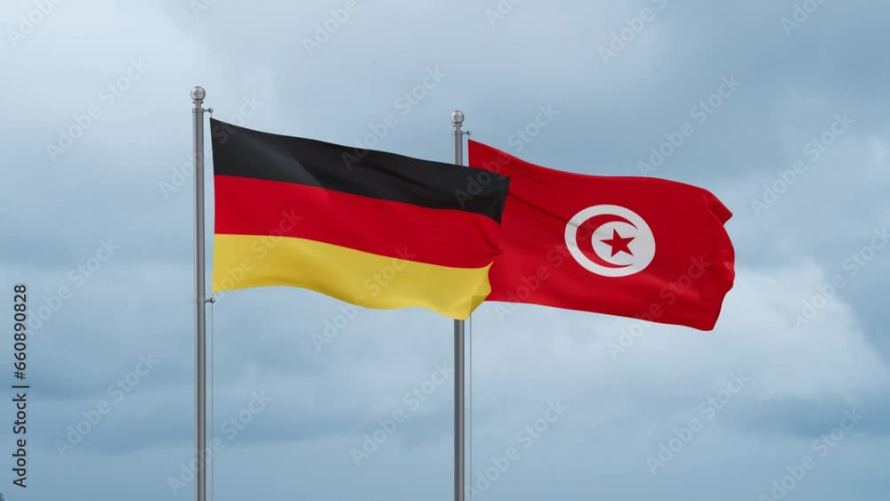 Tunisia and Germany flag waving together on cloudy sky, endless seamless loop, two country cooperation concept Tunisia and Germany flag waving together on cloudy sky, endless seamless loop, two country cooperation concept