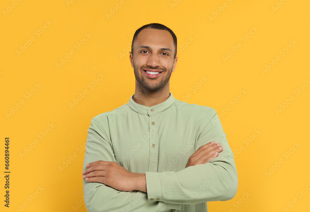 Portrait of handsome young man on orange background Portrait of handsome young man on orange background