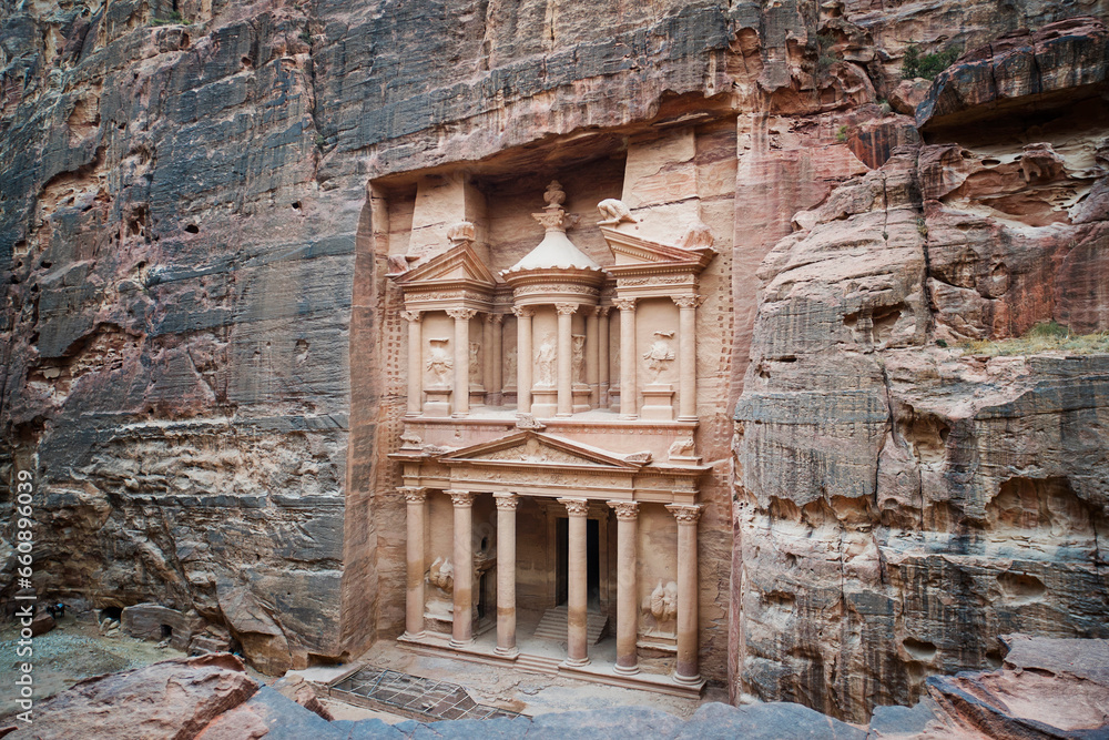 ancient treasury in Petra Jordan seen from the Siq. view from the top. main attraction of the lost city of Petra in Jordan. temple is entirely carved into the rock. Ancient old architecture