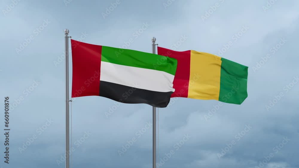 Republic of Guinea flag and United Arab Emirates UAE flag waving together on cloudy sky, endless seamless loop, two country relations concept Republic of Guinea flag and United Arab Emirates UAE flag waving together on cloudy sky, endless seamless loop, two country relations concept