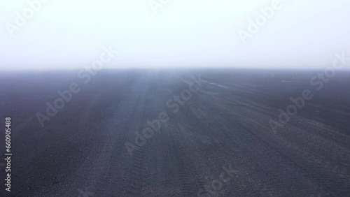 Road to nowhere. The rover is moving in the fog on a volcanic plateau, which is dotted with pyroclastic material from a recent eruption. Kamchatka photo