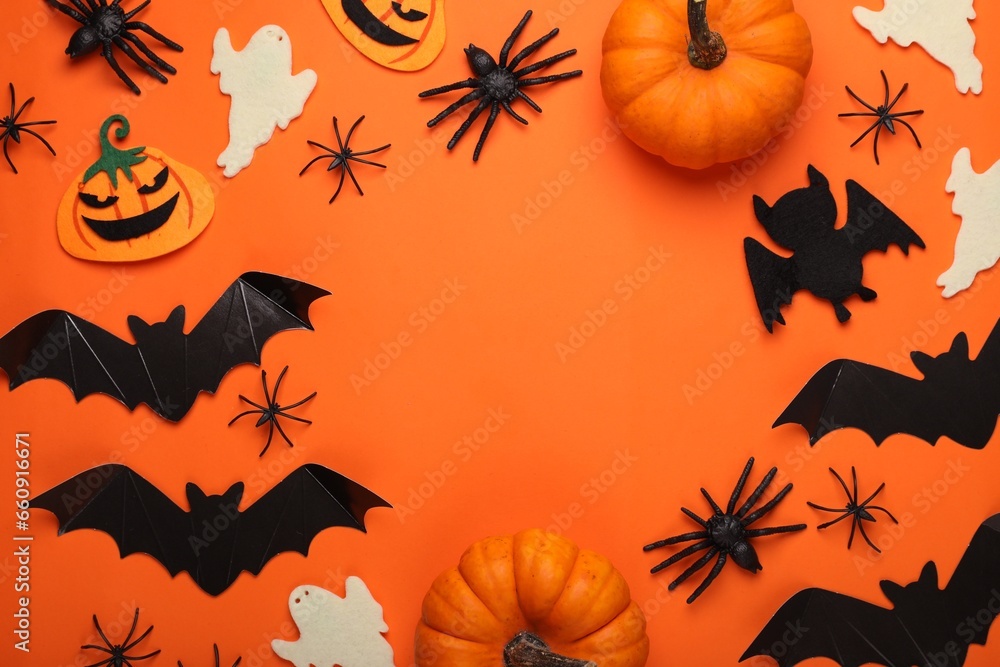 Flat lay composition with bats, pumpkins, ghosts and spiders on orange background, space for text. Halloween celebration Flat lay composition with bats, pumpkins, ghosts and spiders on orange background, space for text. Halloween celebration