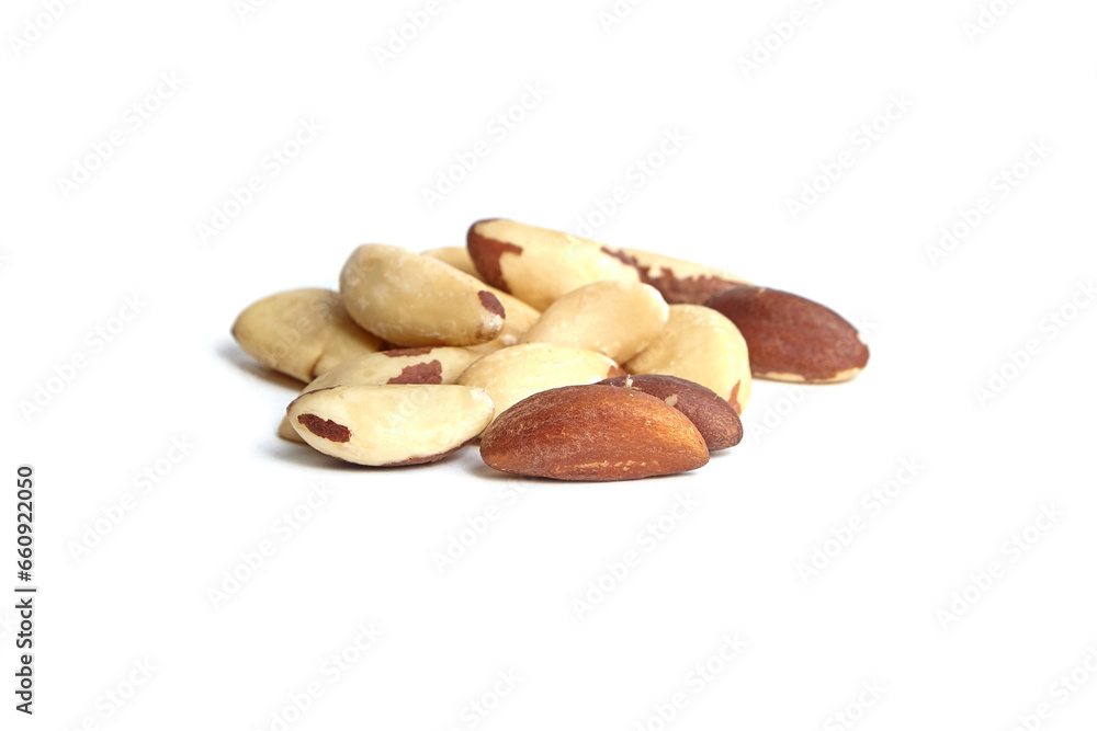 Fototapeta premium Brazil nuts isolated on white background. Shelled Brazil nuts, a nutty treat