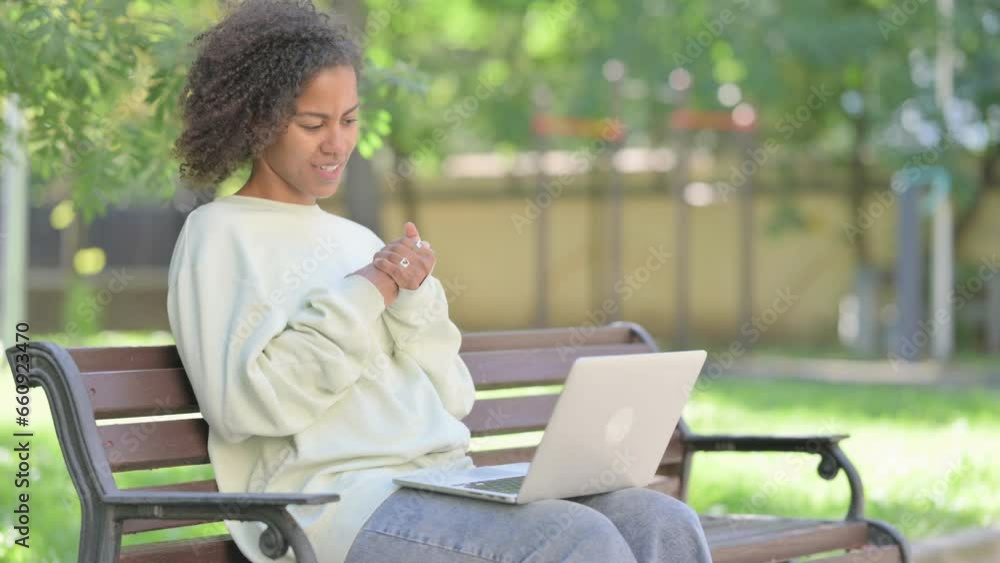 Online Video Chat by Young African Woman on Laptop Outdoor Online Video Chat by Young African Woman on Laptop Outdoor