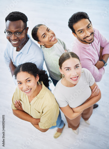 Top view, people and smile on portrait in office, collaboration and pride for teamwork in company. Happy diversity coworkers, unity and confidence in solidarity, positive and together in workplace © Rene L/peopleimages.com