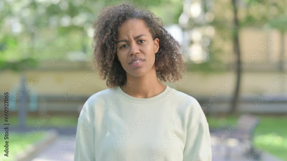 Outdoor Portrait of Upset Young African Woman Reacting to Failure Outdoor Portrait of Upset Young African Woman Reacting to Failure