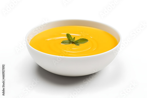 Warm pumpkin soup on a white background, seasonal food