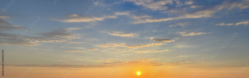 Sunset sun on golden sky with cloud. Sunrise horison skyline background