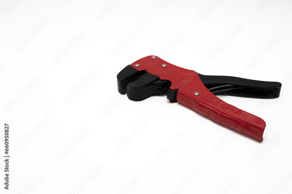 wire stripper with red and black handles isolated on white wire stripper with red and black handles isolated on white