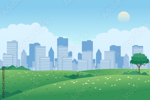 City park panoramic landscape with green grasslands, meadow, and buildings in background.