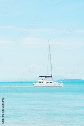 Tranquil blue sea with a cruise boat in clear weather in Phang Nga Bay  Phuket  Thailand.