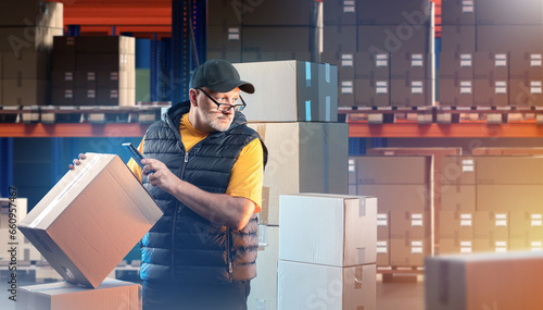 Man works in warehouse. Bus...