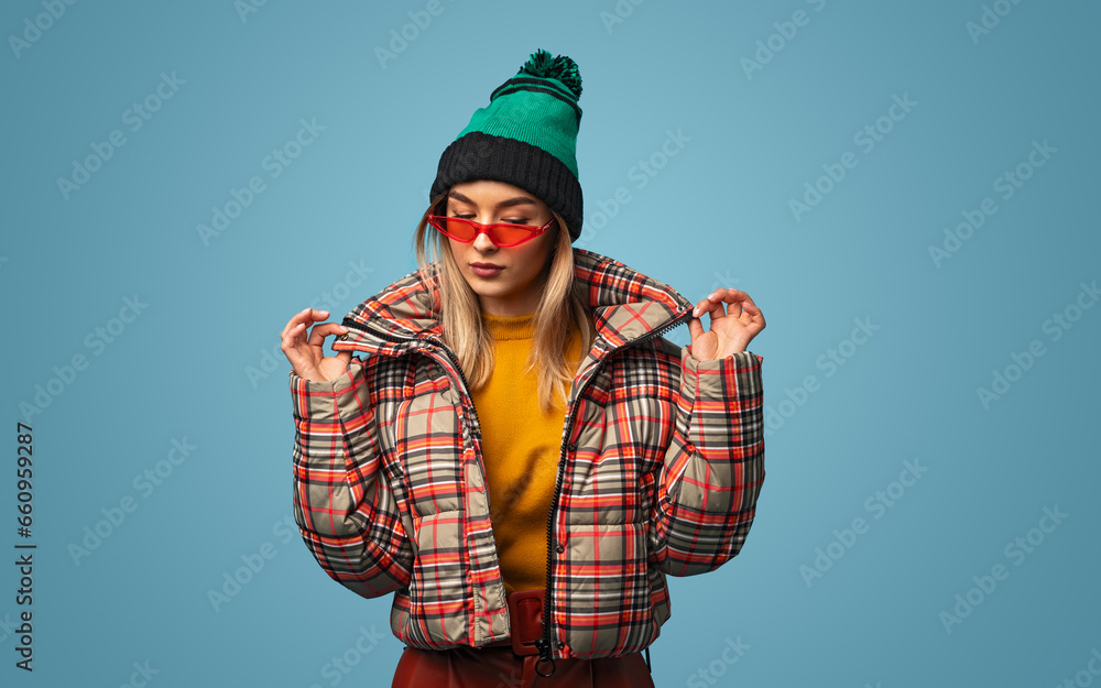 Stylish woman in warm jacket and sunglasses Stylish woman in warm jacket and sunglasses