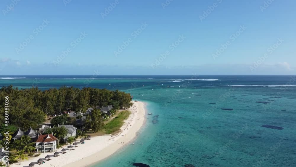 Le Morne tropical beach and famous kite, surf spot aerial panoramic view with palm trees and white sand blue ocean and sunbeds with umbrellas, Mauritius Le Morne tropical beach and famous kite, surf spot aerial panoramic view with palm trees and white sand blue ocean and sunbeds with umbrellas, Mauritius