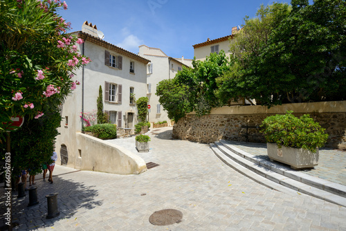 View of traditional French townhouses with plants in the courtyard - June 2018 - Saint-Tropez, French Riviera (Côte d'Azur), France