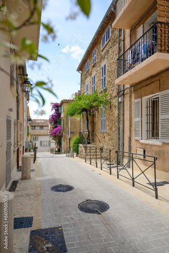 View from the street of traditional French townhouses - June 2018 - Saint-Tropez, French Riviera (Côte d'Azur), France