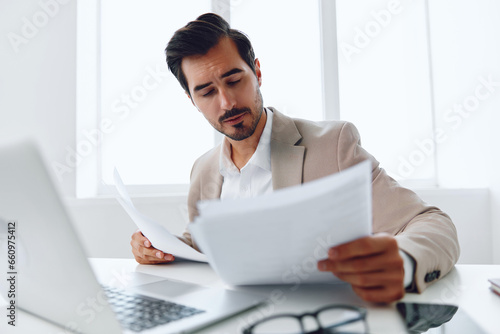 Businessman document office suit laptop company paper planning happy holding