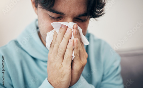 Фотография Man, sick and couch with tissue, sickness and virus for infection, sinus and cold symptoms