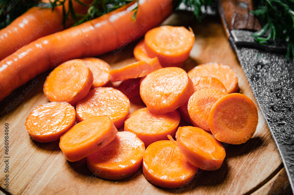 Fresh chopped carrots on a cutting board. Fresh chopped carrots on a cutting board.