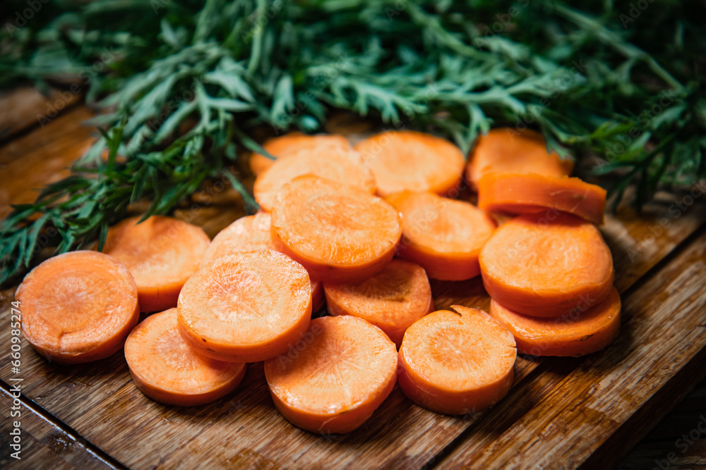 Fresh chopped carrots on cutting board. Fresh chopped carrots on cutting board.