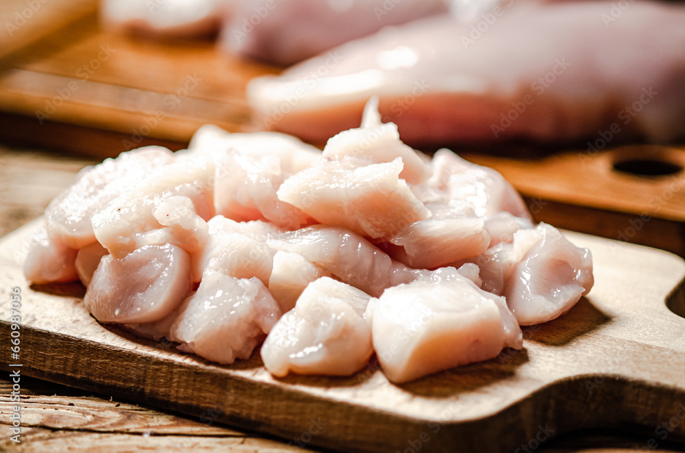 Sliced chicken fillet. On cutting board. Sliced chicken fillet. On cutting board.