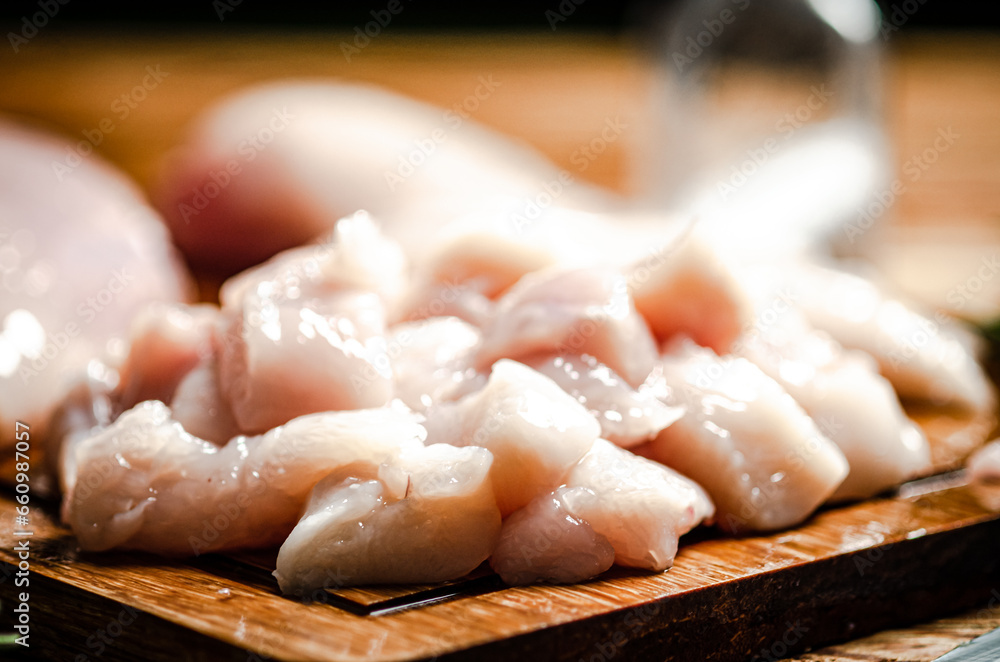 Sliced chicken fillet. On cutting board. Sliced chicken fillet. On cutting board.