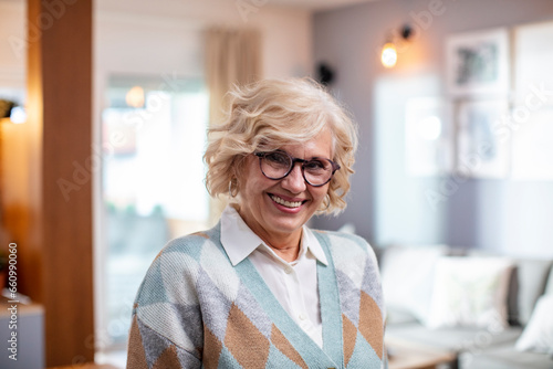 Portrait of senior woman posing at her home photo