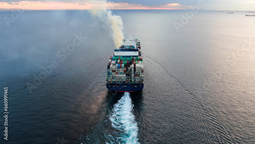 Aerial view of freight ship with cargo containers.