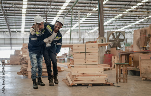 Foreman technician injured at leg from accident crying with pain in warehouse. Female engineer emergency help colleague who falling down get physical injury in workplace. Risk, dangerous in workplace.