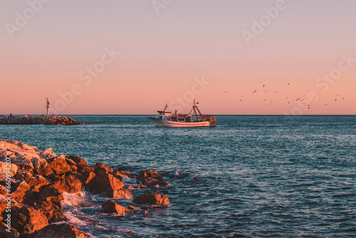 fishing boat in sunset 