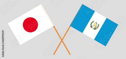 Crossed flags of Japan and Guatemala. Official colors. Correct proportion