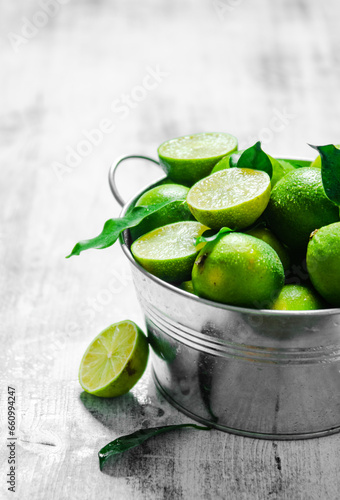 Fresh limes. On white table. © Artem Shadrin