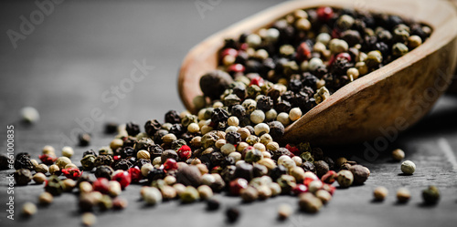 Peppercorn on rustic background.