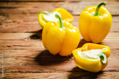 Vászonkép Fresh sweet pepper. On wooden table.