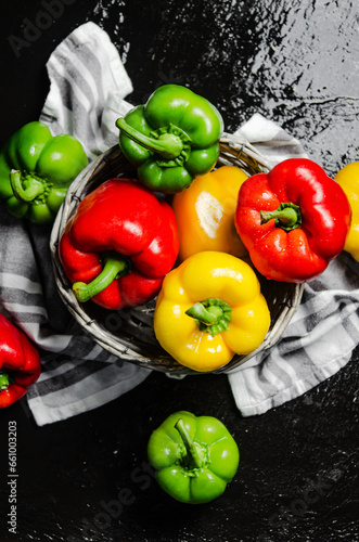 Fresh sweet pepper. On black table.