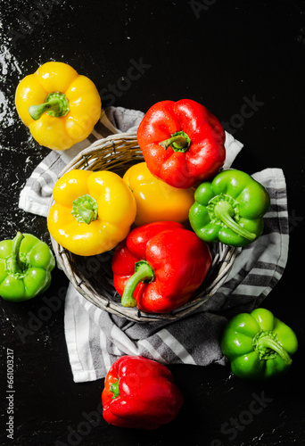 Fresh sweet pepper. On black table.