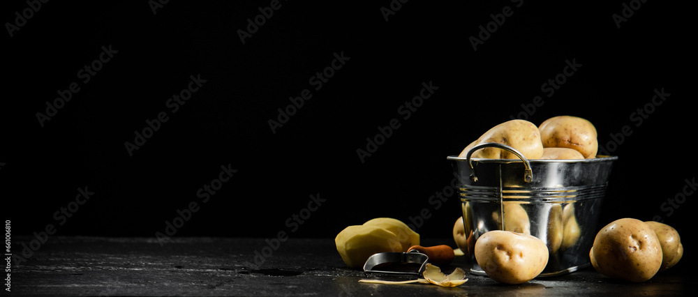 Fresh potatoes. On black background. Fresh potatoes. On black background.