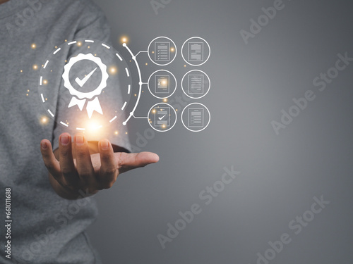 Guarantee quality and control standard system, Businessman showing the ISO quality certification mark, a standard that recognizes organizations in their work. Process efficiency for the company