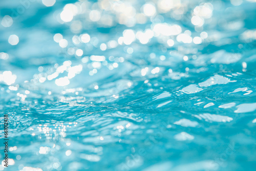 Photography Water and air bubbles over blue background,sea wave ,Bokeh light background in the pool,Hotel swimming pool with sunny reflections