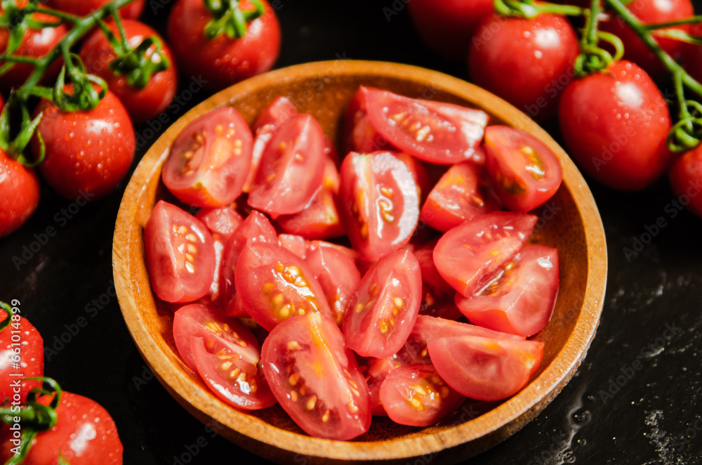 Fresh chopped tomatoes. On black table. Fresh chopped tomatoes. On black table.
