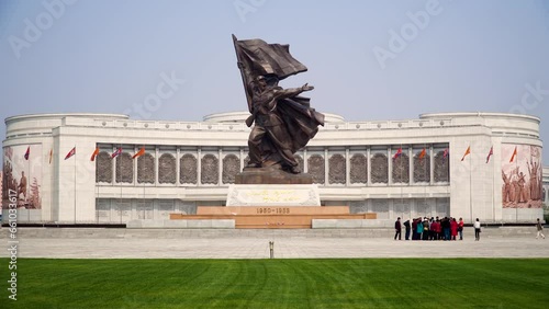Pyongyang, North Korea, group of tourists visiting the Victory Monument Victory Monument