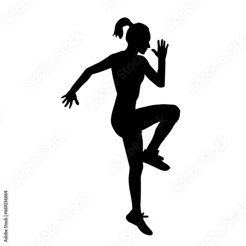 Silhouette of a sporty female doing workout. Silhouette of a slim woman athlete in action pose doing exercise.