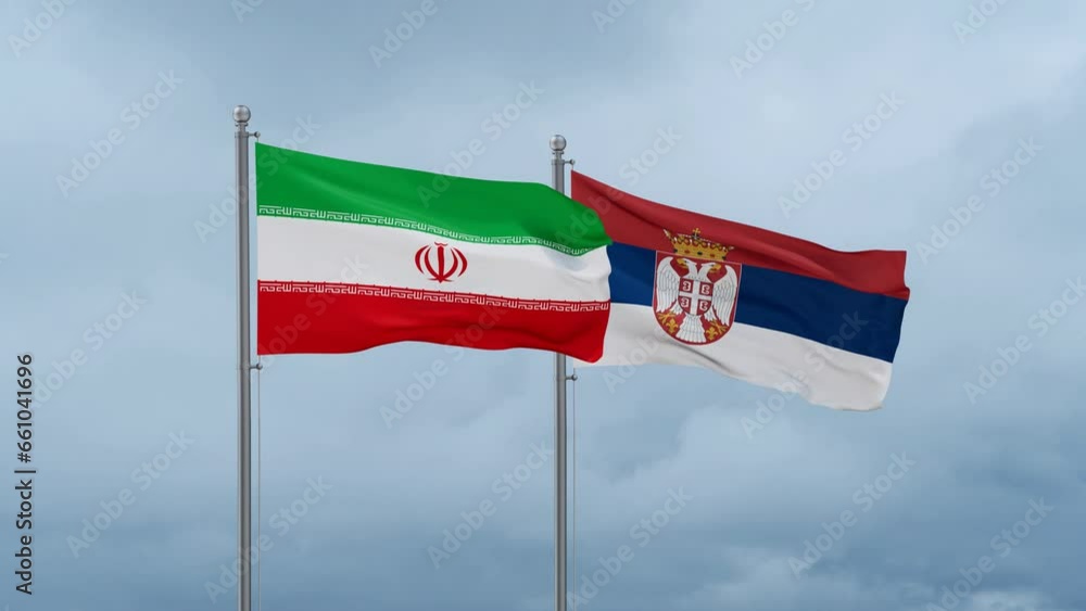 Republic of Serbia and Iran flag waving together on cloudy sky, endless seamless loop, two country cooperation concept Republic of Serbia and Iran flag waving together on cloudy sky, endless seamless loop, two country cooperation concept