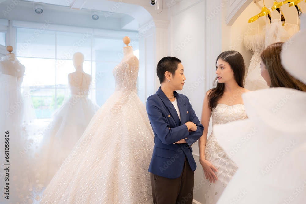 LGBT couples are choosing wedding gowns, with designers advising them on how to make them suitable and lovely for the bride.