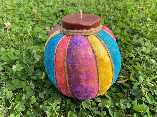 Decorated pumpkin and a candle inside