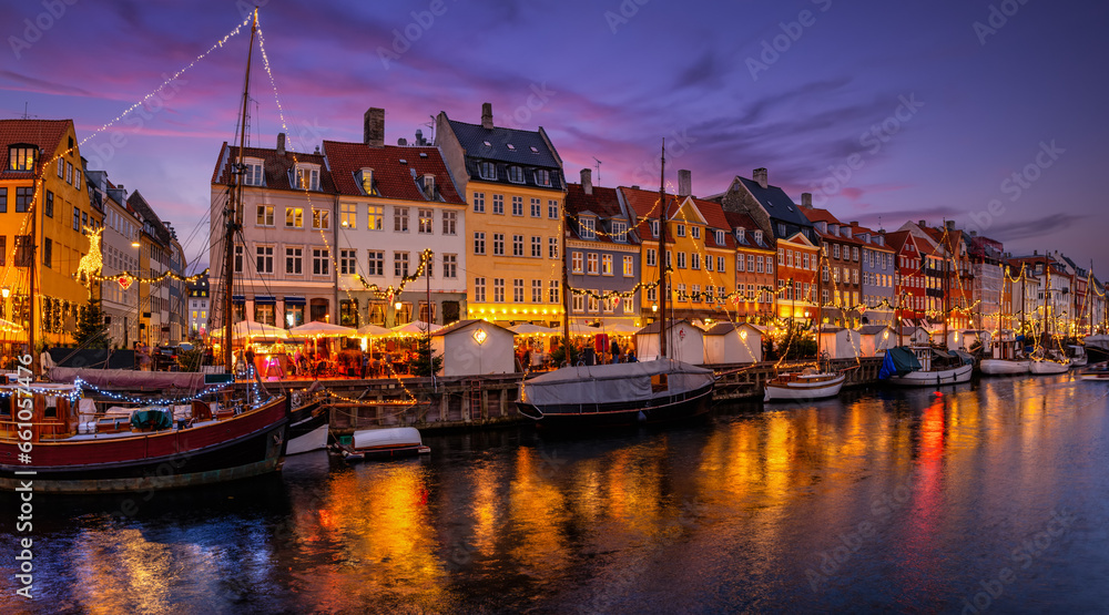 Beautiful winter evening view of the popular Nyhavn area at Copenhagen, Denmark, decorated for Christmas time - obrazy, fototapety, plakaty 